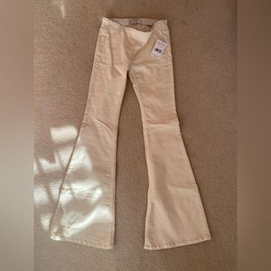 Free People cream colored flare pants.
